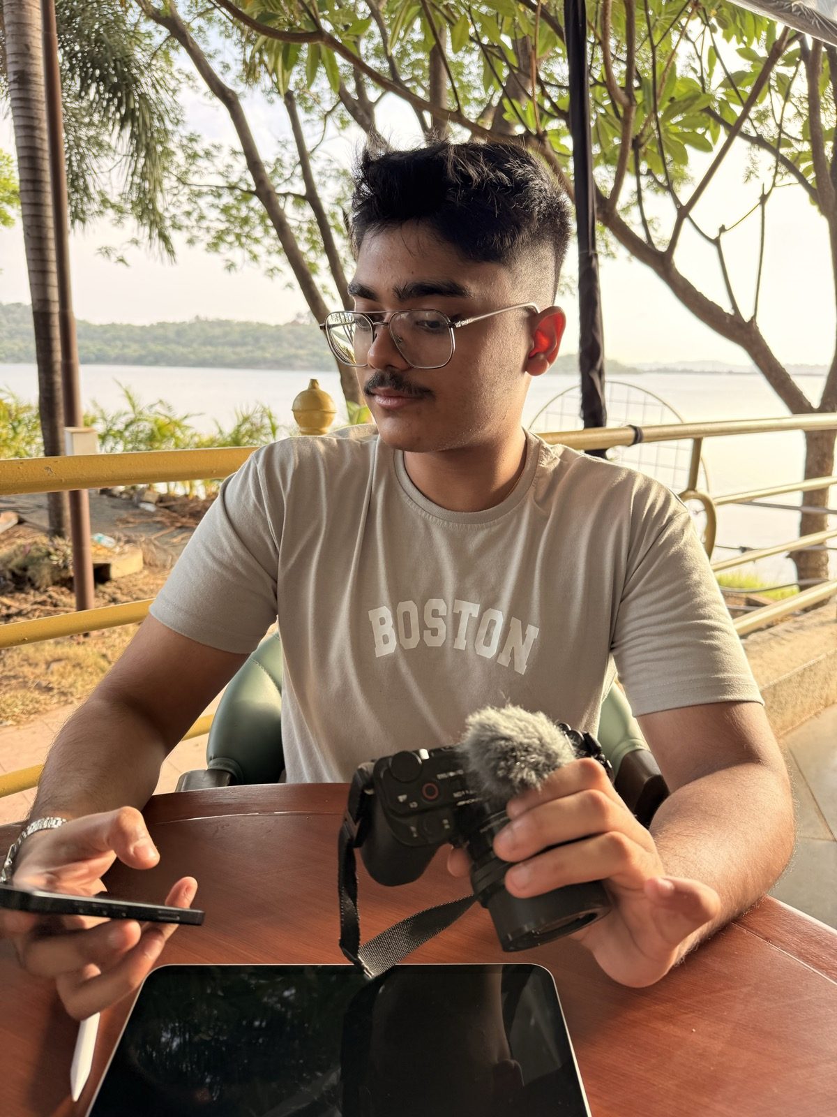 RapidXAI founder Shreyas Raj on a content shoot with a camera in Lonavala, Maharashtra